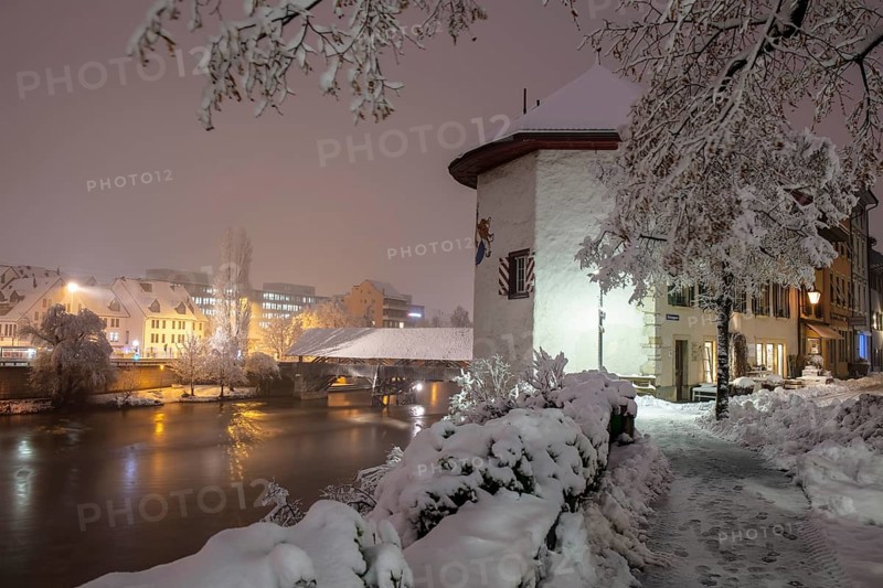 Objective tower and wooden bridge over the Aare