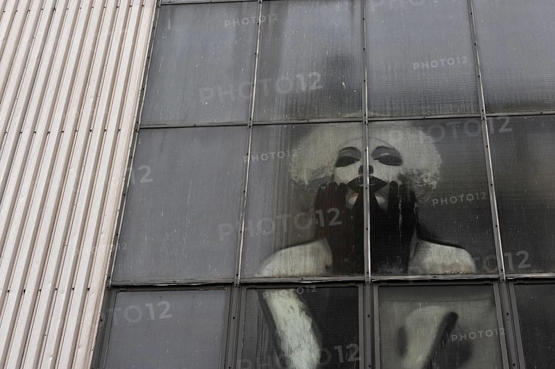 Industrial window with Marilyn Monroe behind the panes