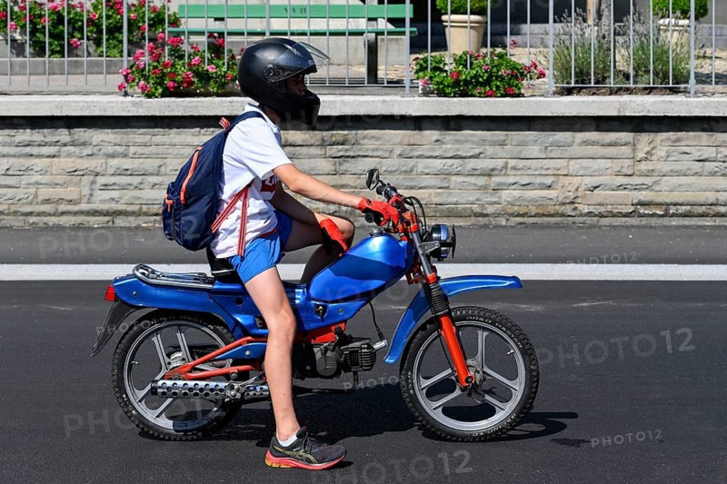 Teenager with tuned moped