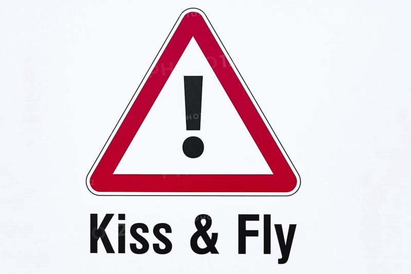 Kiss & Fly warning sign