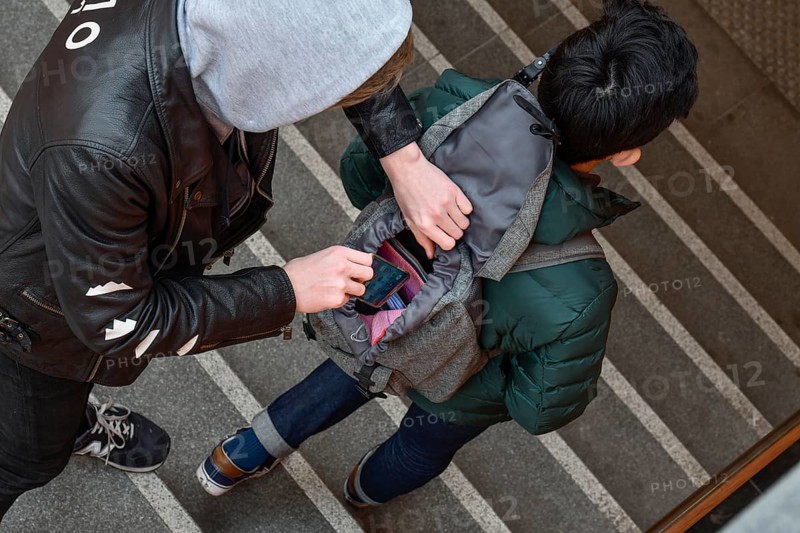 Theft of a mobile phone from a backpack