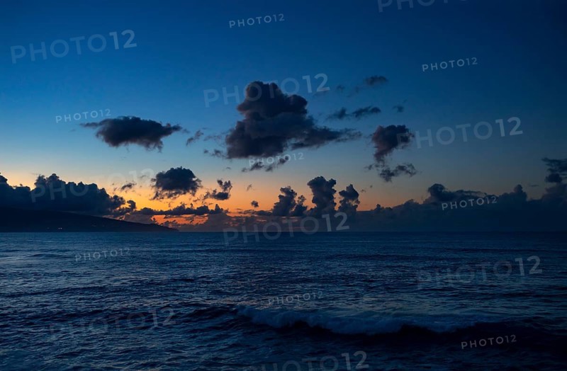 Sunset with clouds on the beach of Praia de Santa Barbara