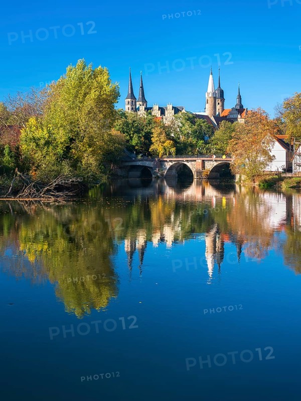 Merseburg Cathedral and Merseburg Castle reflected in the river Saale in autumn
