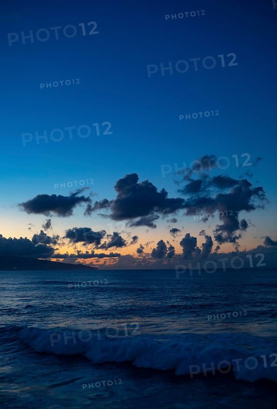 Sunset with clouds on the beach of Praia de Santa Barbara