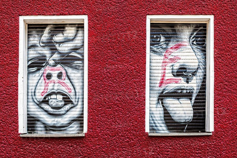 Creative graffiti with emotional statements on the facade of a youth psychiatrist's house