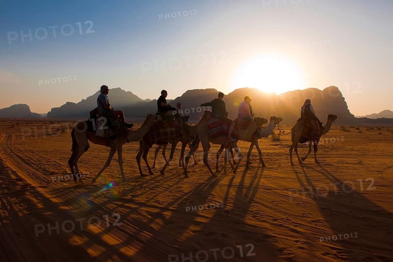 Tourist riding camels