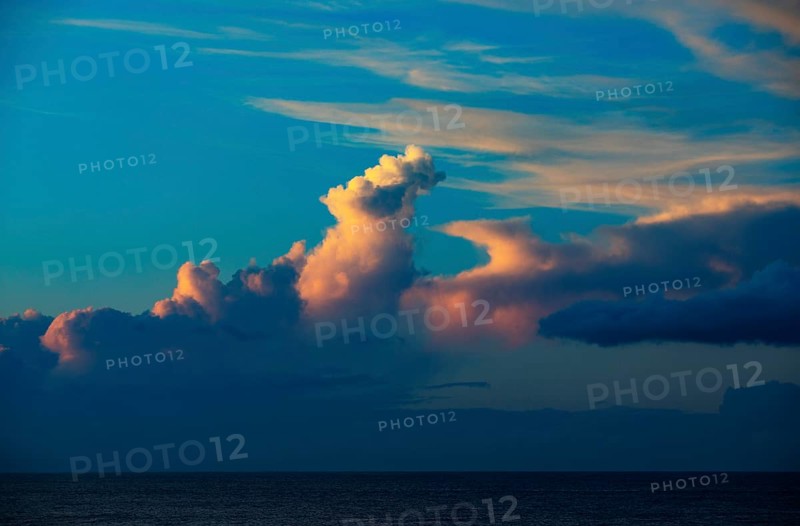 Sunset with clouds on the beach of Praia de Santa Barbara