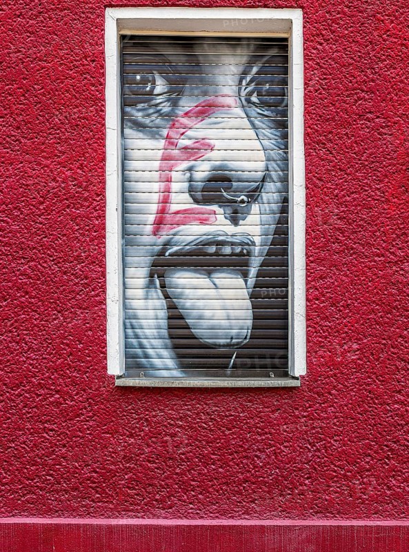 Creative graffiti with emotional statements on the facade of a youth psychiatrist's house