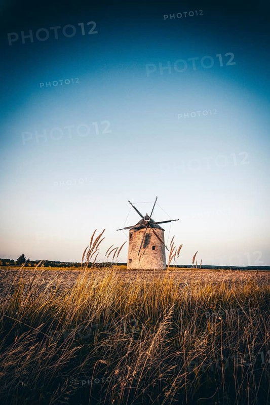 The Old Windmill of Tes in the sunset with guests