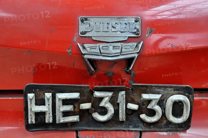 Rear of a red Ford diesel car with old number plate