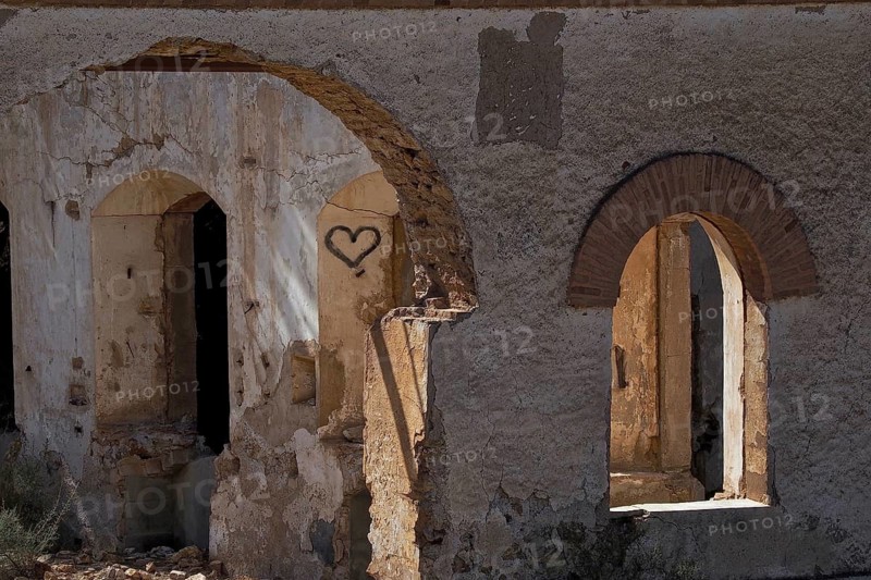 Abandoned house with round arches
