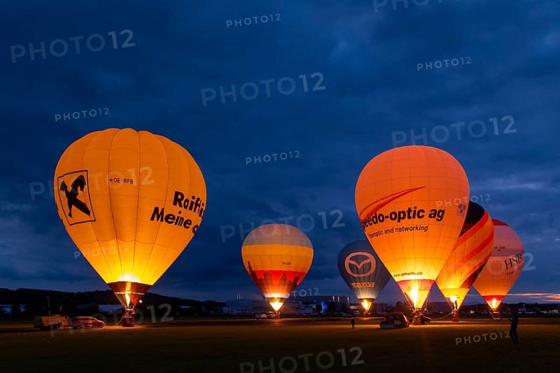 Hot air balloons on the ground during balloon lighting