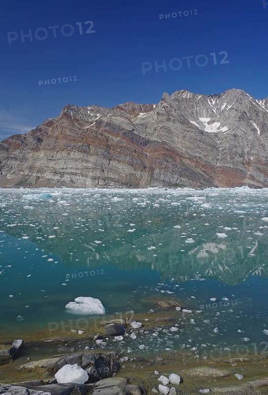 View of a fjord filled with drift ice