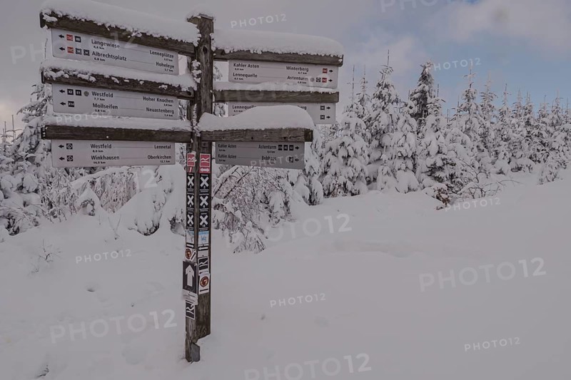 Signpost in winter on the Kahler Asten in Sauerland