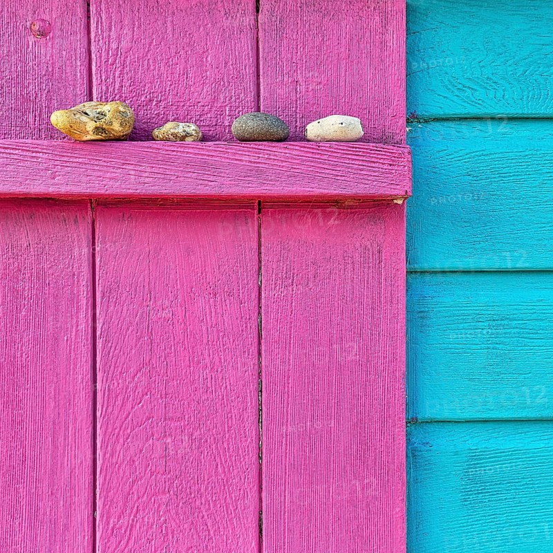 Four discarded stones on a beam