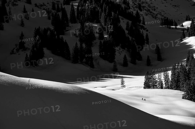 Two ski tourers in wintry mountain landscape