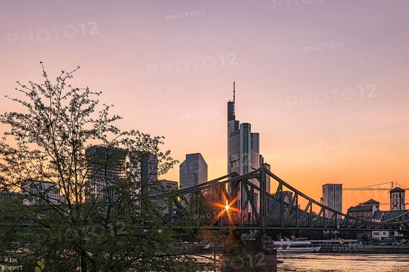 View over the Main River to the skyline of Frankfurt am Main at sunset