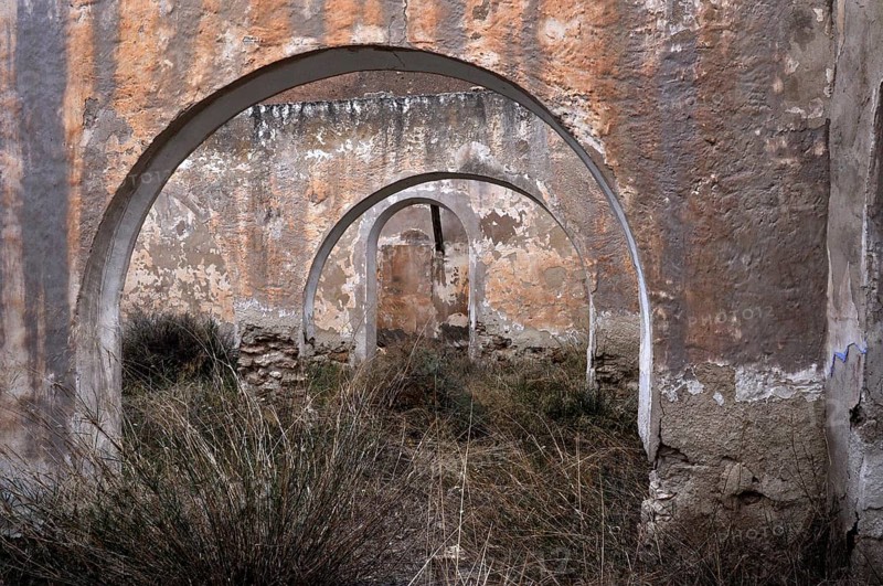 Abandoned house with round arches
