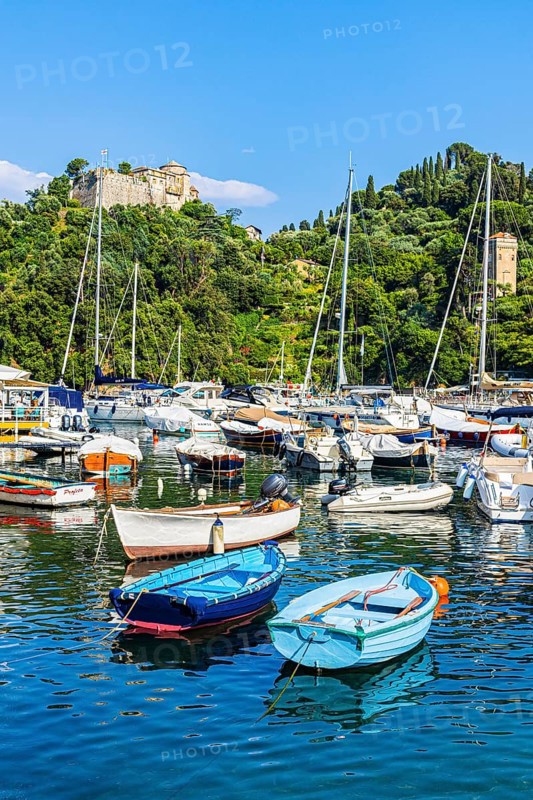 Boats and sailing yachts anchored in Portofino harbour