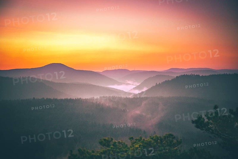 View from the sandstone rock Wachtfelsen to the sunrise
