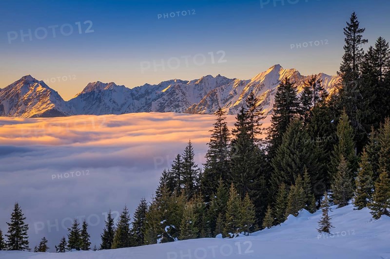 Winter mountain landscape with closed fog cover over the Inn valley