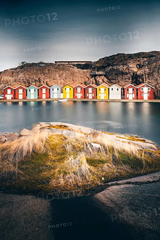 Boats and colourful boathouses in Smoegen Harbour