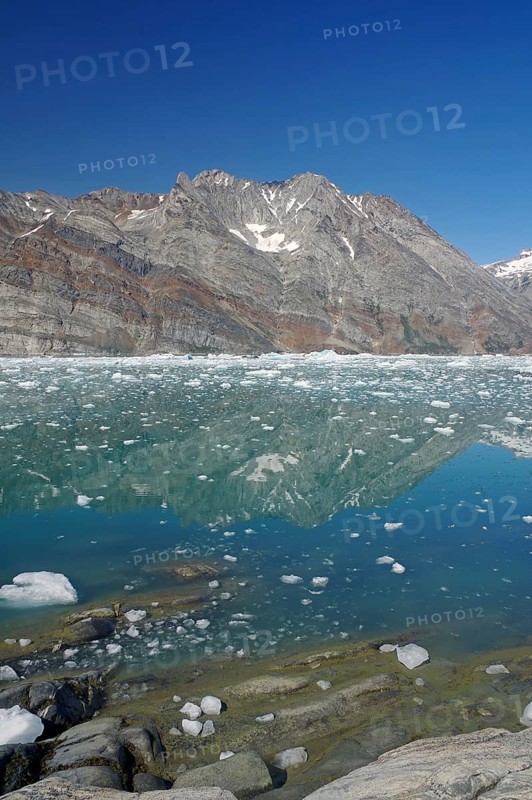 View of a fjord filled with drift ice