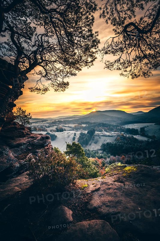 View from the sandstone rock Wachtfelsen to the sunrise