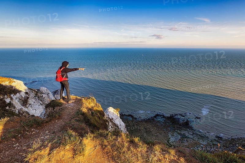 Hikers on cliff top