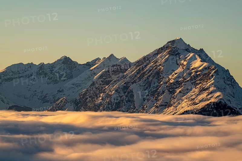Winter mountain landscape with closed fog cover over the Inn valley