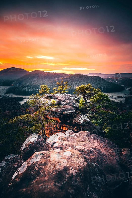 View from the sandstone rock Wachtfelsen to the sunrise