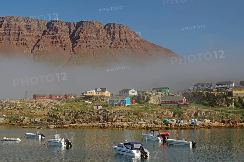Cloud wall and some multicoloured wooden houses