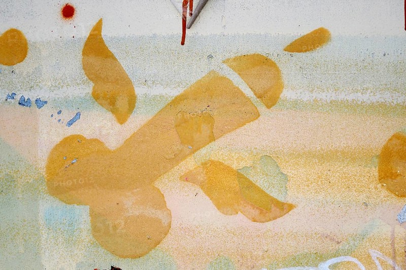 Flying phallic symbol with wings sprayed on wall