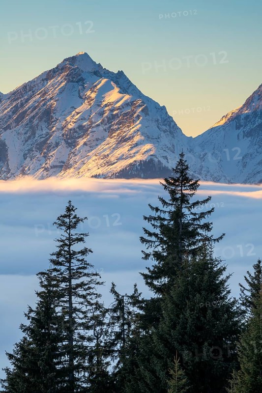 Winter mountain landscape with closed fog cover over the Inn valley