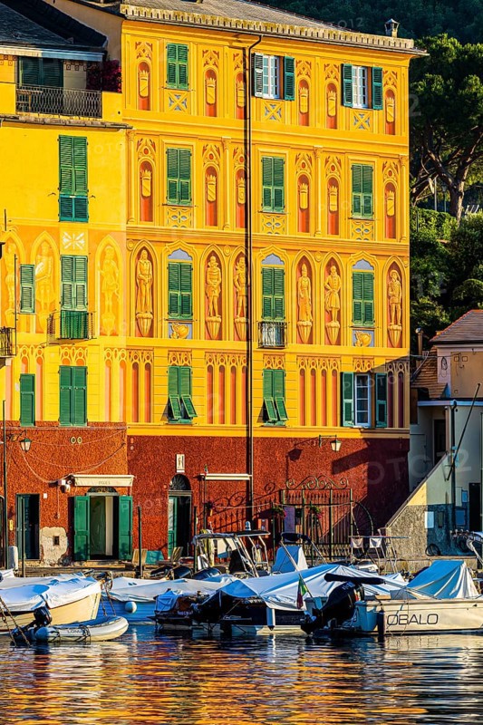 Historic house facade in the morning light in Portofino harbour