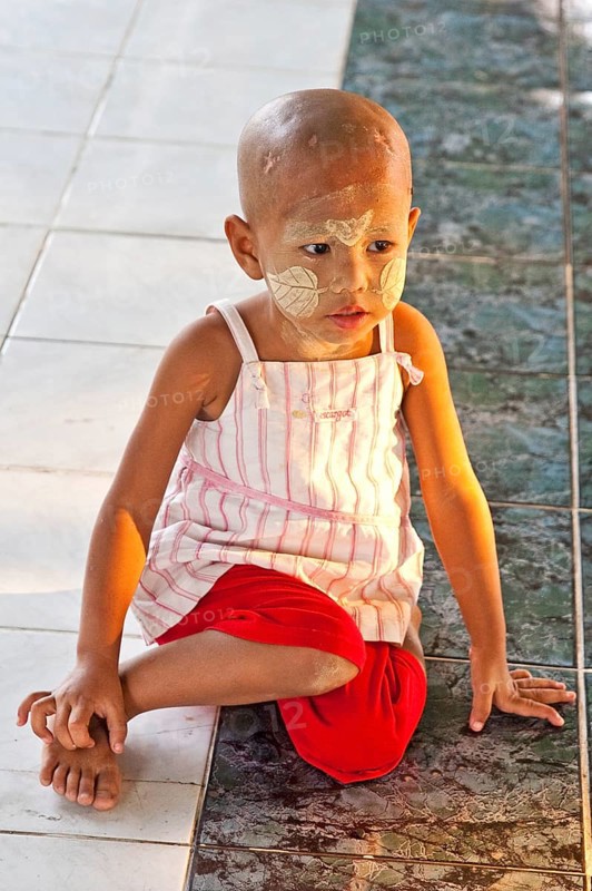 Boy with face painting with Tanaka paste