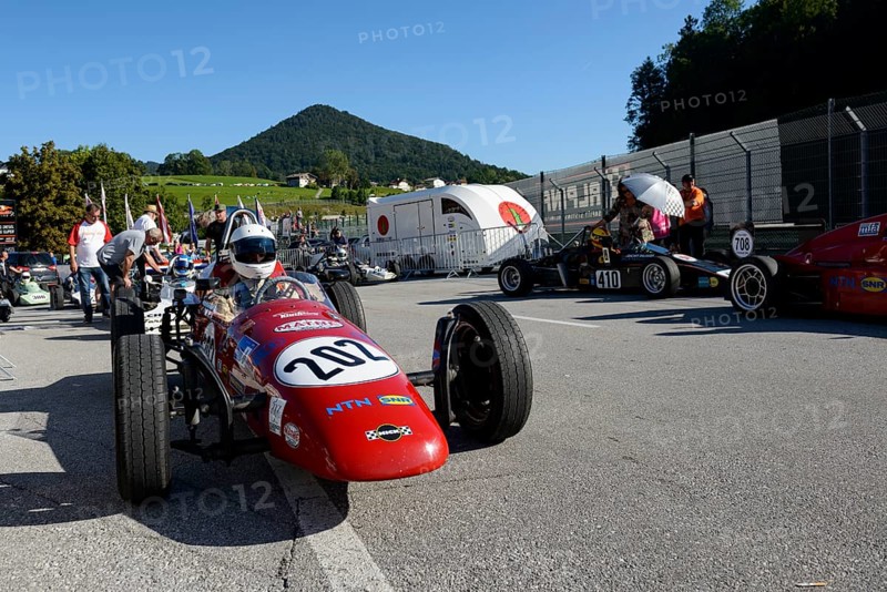 Historic race cars in waiting position