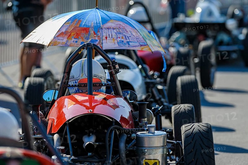 Historic race cars in waiting position