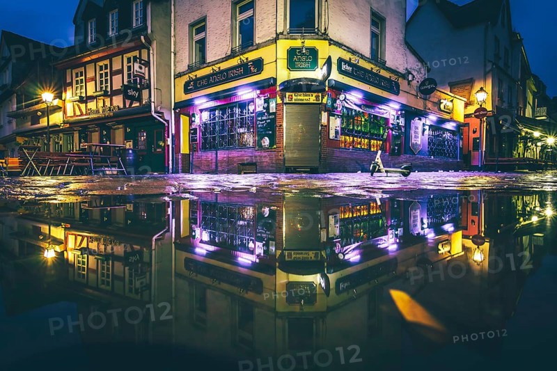 Reflection of an Irish pub in a puddle