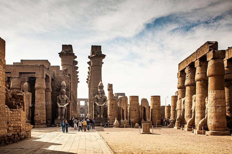 South doorway to the Great Colonnade with colossal statues of Ramses II. Luxor Temple