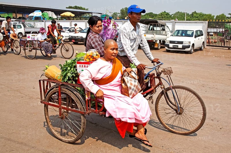 Female monk on cycle rickshaw