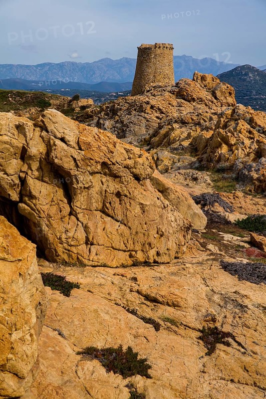 Genoese Tower in L'Ile-Rousse with the offshore island of La Pietra