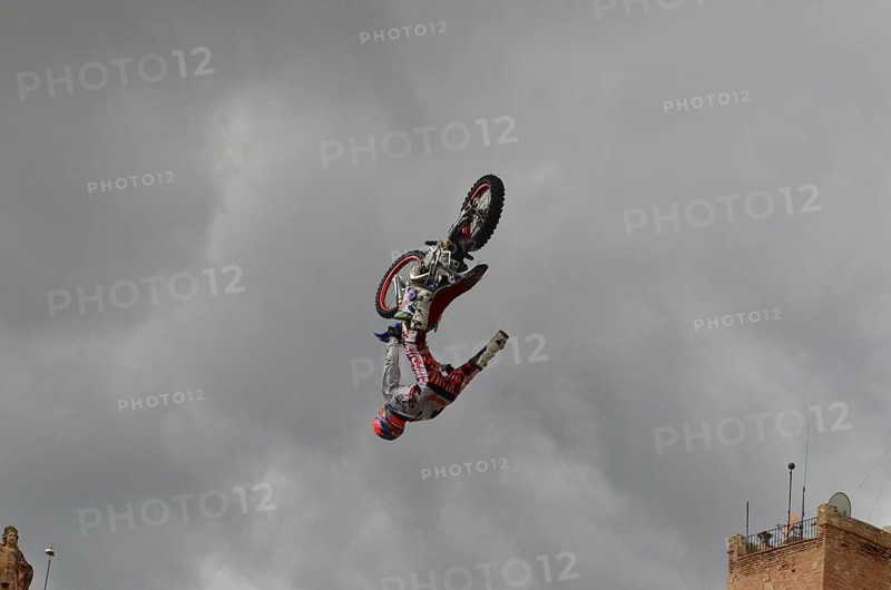 Motorbike performer doing a somersault in the old town of Lorca