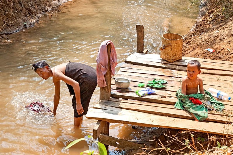 Washing clothes on the banks of the Nam Pilu River