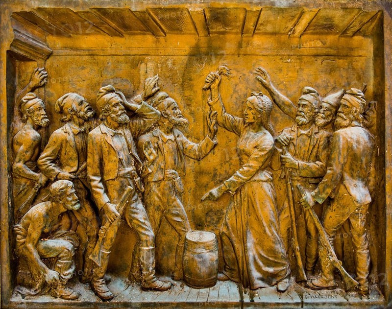 Gaffori's woman Faustine holds a flaming torch over a powder keg