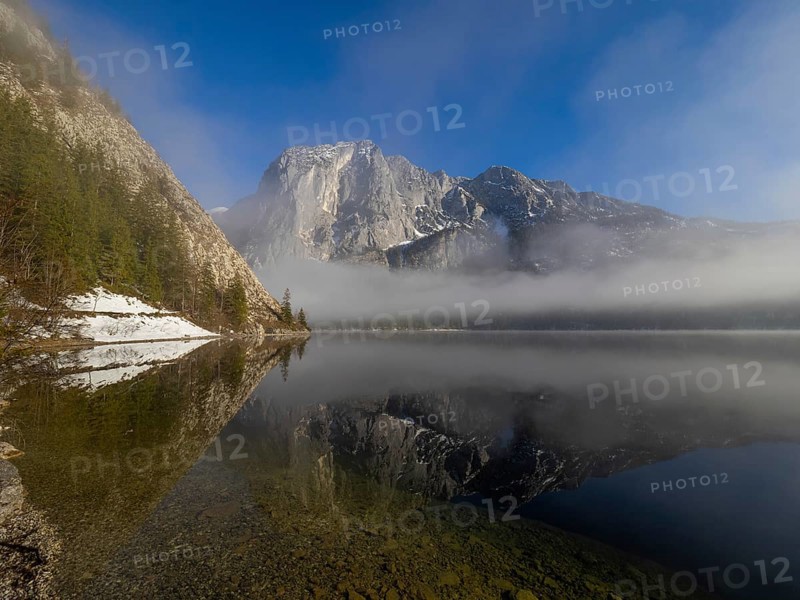 Fog lifts in front of the Trisselwand