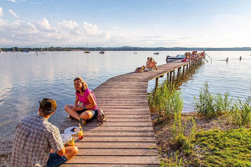 Man and woman sitting on the jetty