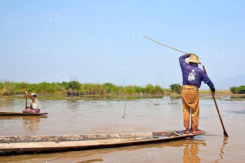 Fishermen with fish trap and nets