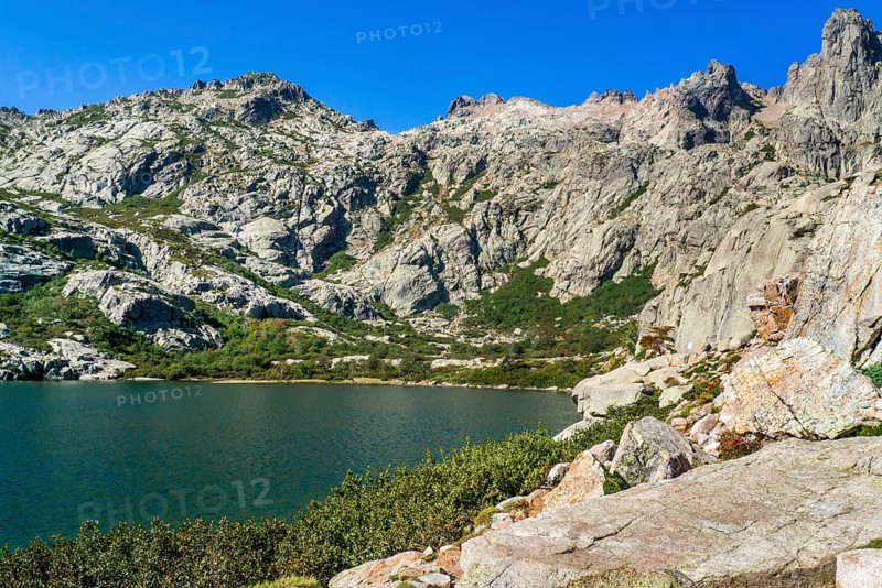 Hiking to the mountain lake Lac de Melo