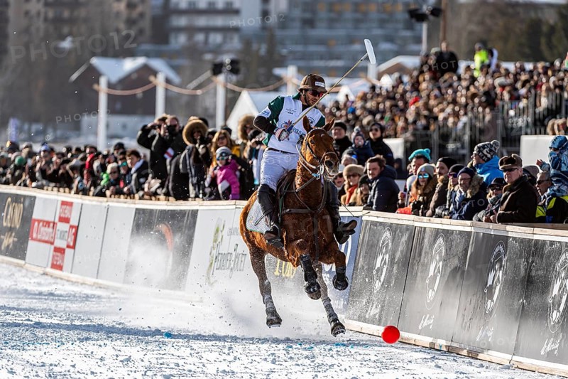 Spectators watch Santiago Marambio of Team Azerbaijan Land of Fire trying to control the ball at the rail